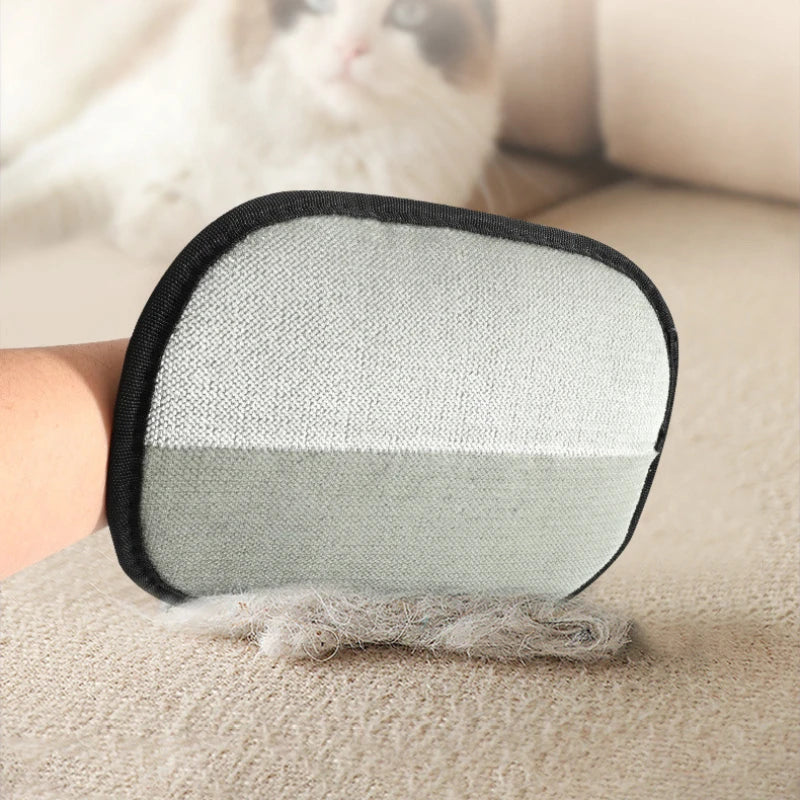 CozyClaw™ pet fur remover glove brush collecting hair from carpet – detail shot