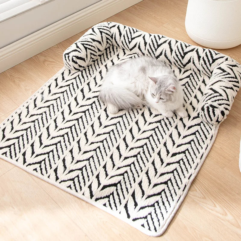 CozyClaw™ plush pet sofa – cat relaxing on mat on wooden floor lifestyle shot