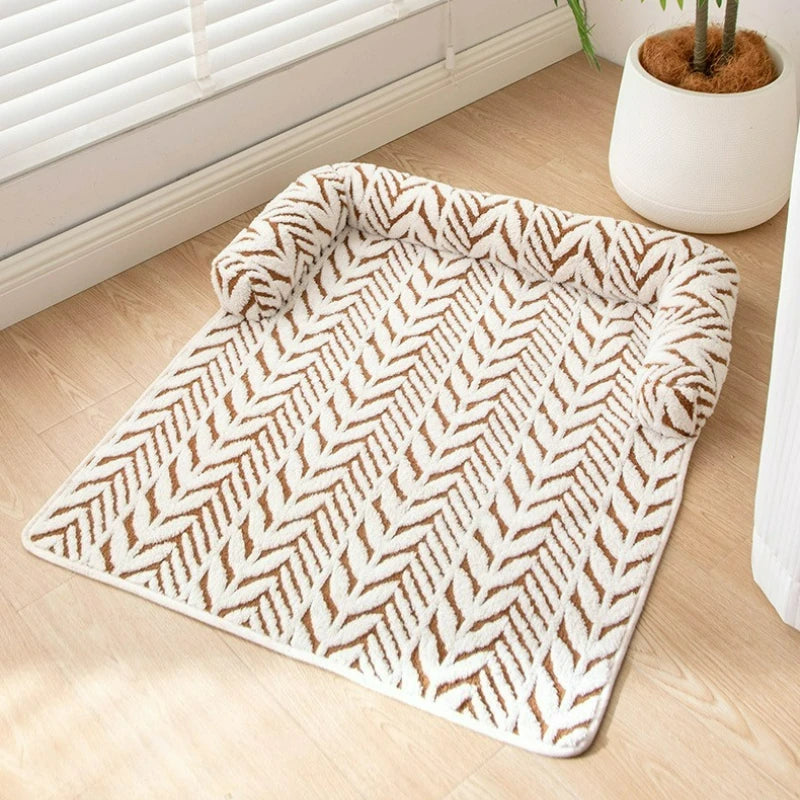 Patterned rug on a wooden floor with a plant in the background